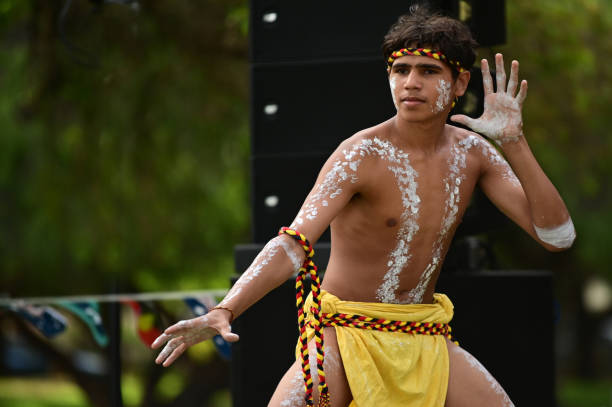 Aboriginal Australians man dancing traditional dance during Australia Day celebrations Perth,Wa - Jan 24 2021:Aboriginal Australians man dancing traditional dance during Australia Day celebrations.In 2016 Australian Census, Indigenous Australians comprised 3.3% of Australia's population indegious culture stock pictures, royalty-free photos & images