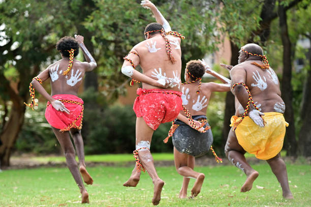 Aboriginal Australians People dancing traditional dance during Australia Day celebrations stock photo
