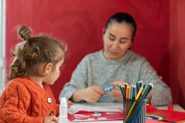 istock Mother And Preschooler Daughter Doing Handicraft 1299010368