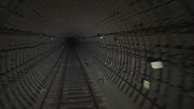 Underground Railway Tunnel For Subway Train. Train Rides Through Tunnel, The View From Driver's Cab of a Subway Train
