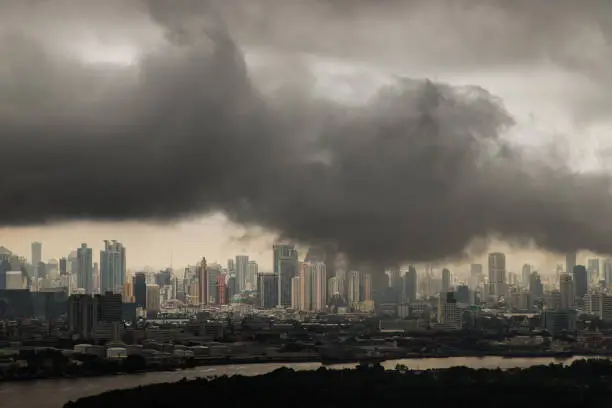 Photo of PM 2.5 or Heavy smog was covered the Bangkok building the morning.There are air pollution under heavy cloud.