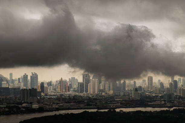 pm 2.5 or heavy smog was covered the bangkok building the morning.there are air pollution under heavy cloud. - storm summer forest cloudscape imagens e fotografias de stock