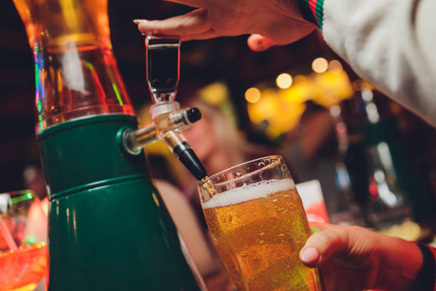 istock Barman pours beer into glasses for its tasting. 1299012316