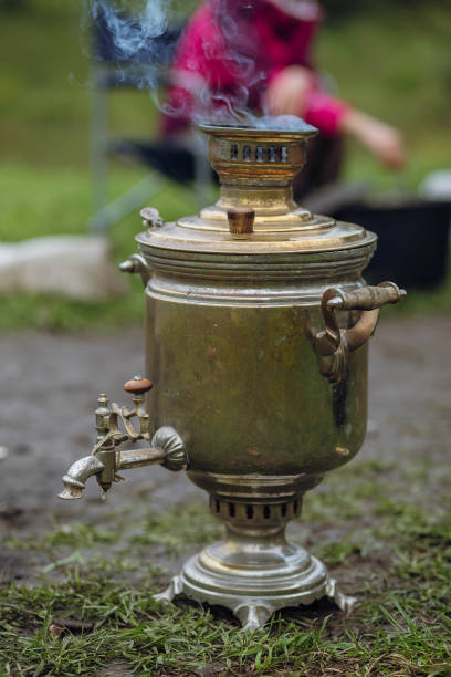 istock Russian samovar boils water for a traditional tea party in nature. 1299012352