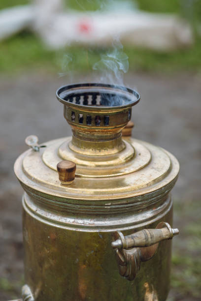 istock Russian samovar boils water for a traditional tea party in nature. 1299012355