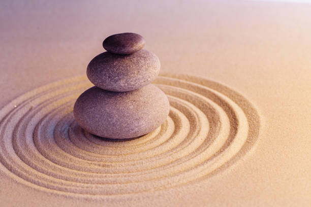 istock Stones on sand, japanese meditation zen garden 1299013681