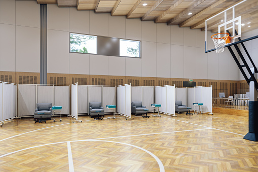 Basketball court transformed into a mass vaccination centre.