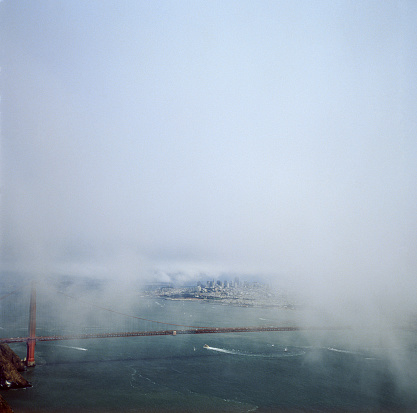 Golden Gate Bridge and San Francisco in the with fog clouds rolling in.

Taken at Marin Headlands, California, USA.