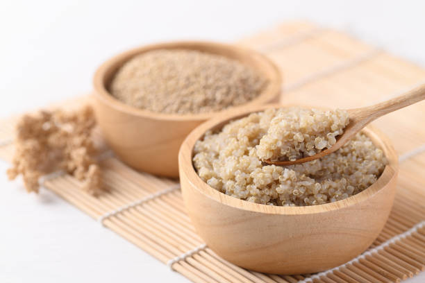 istock Cooked brown quinoa seeds in a wooden bowl 1299016619