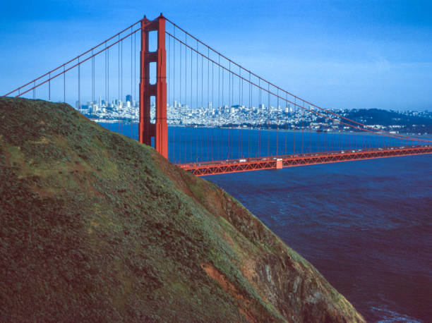 Golden Gate Bridge and San Francisco in the with a few clouds in the background.Taken at Marin Headlands, California, USA.