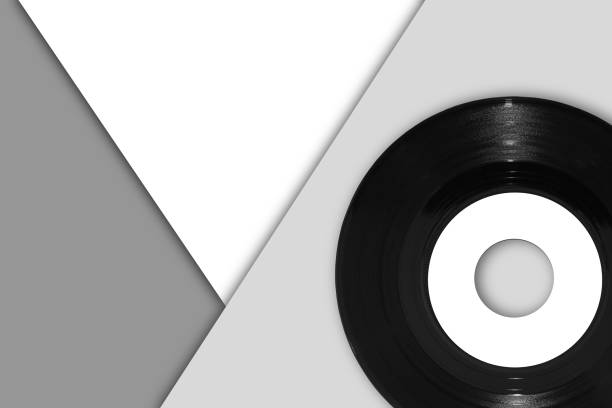 istock 45rpm vinyl single record on monochrome triangle background 1299018817