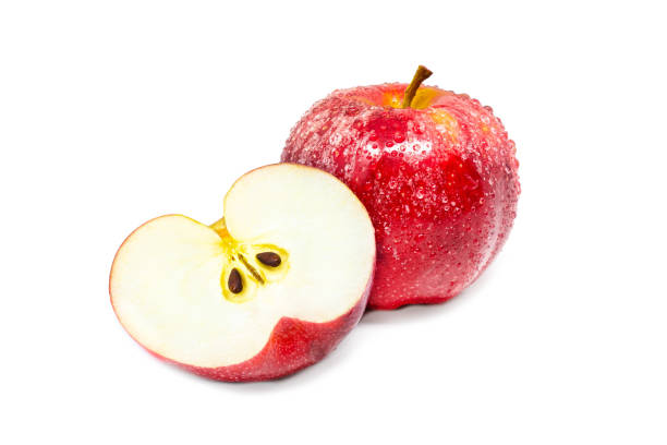 istock Vivid and fresh single and cut in half red apple on isolated background 1299019670