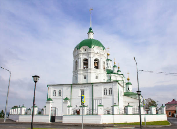Ancient orthodox architecture. Epiphany Church in Eniseisk. Blurry sky with clouds. Ancient orthodox architecture. Epiphany Church in Eniseisk. Blurry sky with clouds. krasnoyarsk krai photos stock pictures, royalty-free photos & images