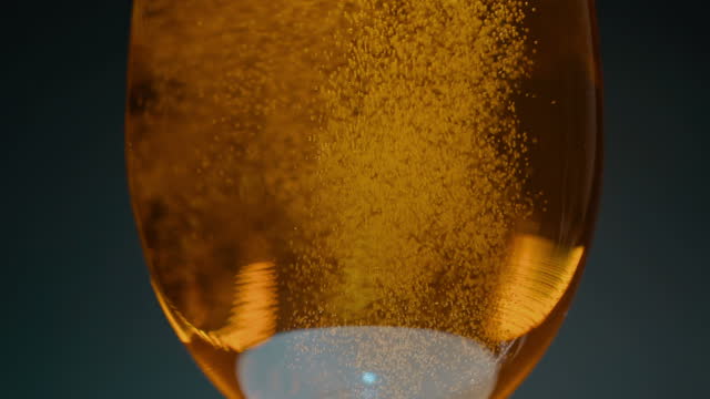 Beer poured into a beer glass in slow motion