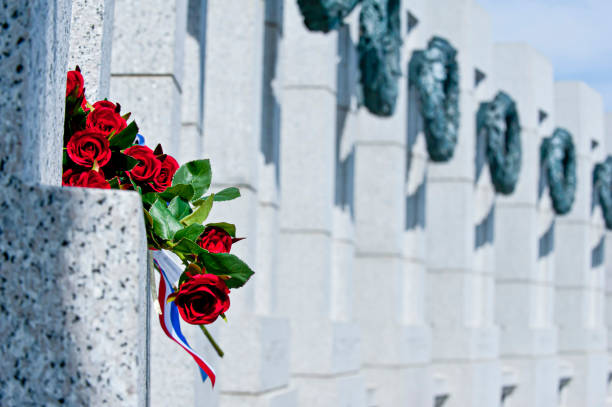 istock Red Roses at memorial 1299022288