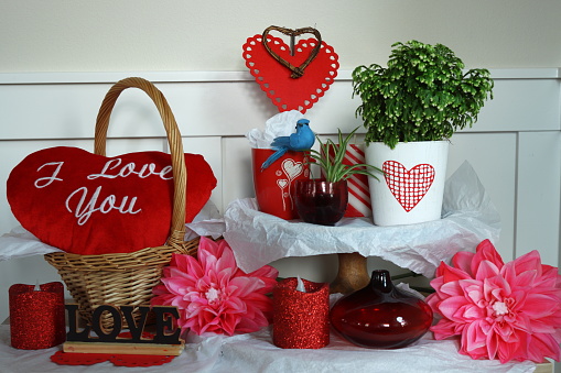 Beautiful tiered decoration of Valentine day theme with hearts, flowers, plants and artifacts