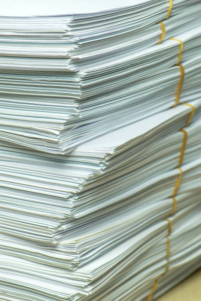 istock pile of paper documents in the office 1299025767