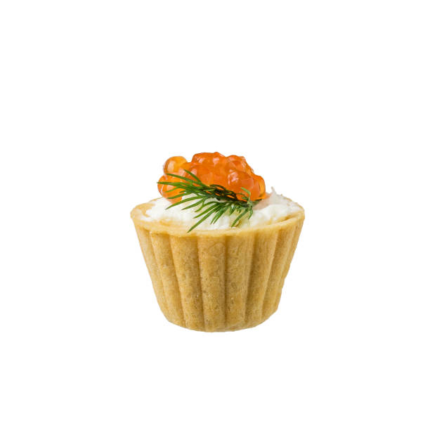 istock Small tartlet with red caviar isolated on a white background. 1299027529