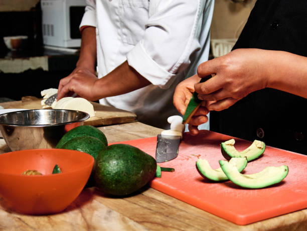 istock Hands of man and woman taking a salad 1299033081