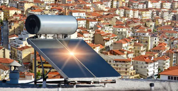 solar heater panels on the roof alternative energy city houses roofs red  above