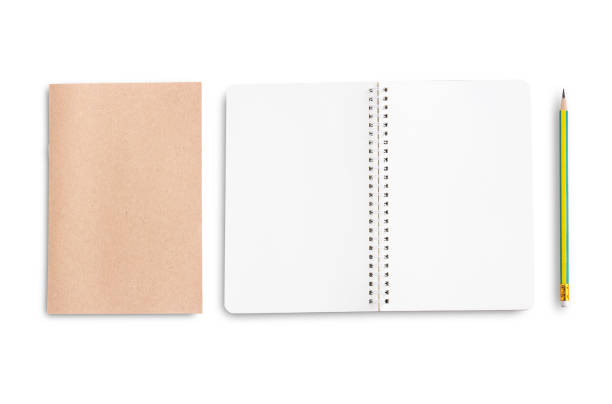 istock Top view of notebook or blank notepad and pencil isolated on white background. 1299038998