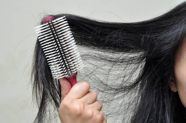 istock The woman is combing her long hair 1299040738