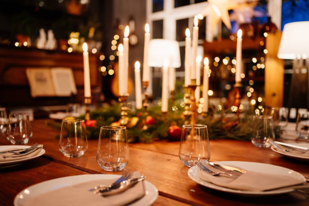 istock large square wooden table served for Christmas dinner. retro styled. Low light. 1299041645