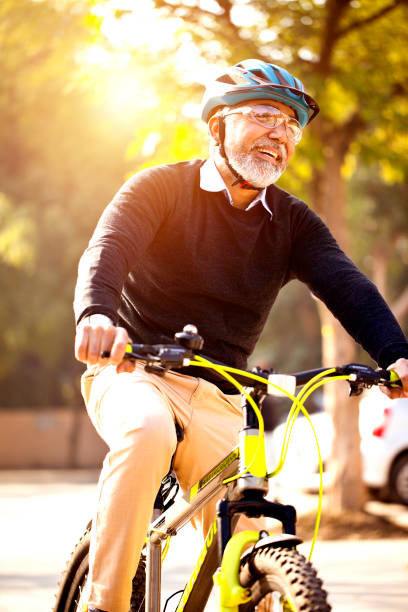 istock Happy man enjoying a bicycle ride 1299041897