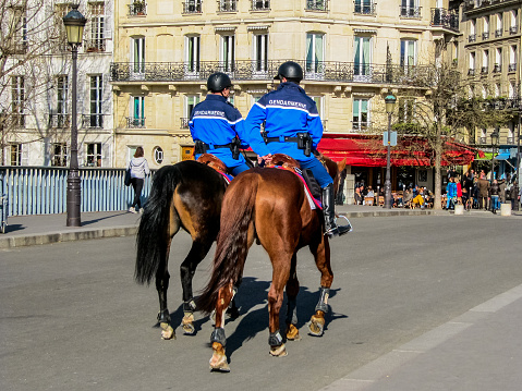 Paris, France - March 22, 2014: Equestrian gendarmerie on the Ile Saint-Louis