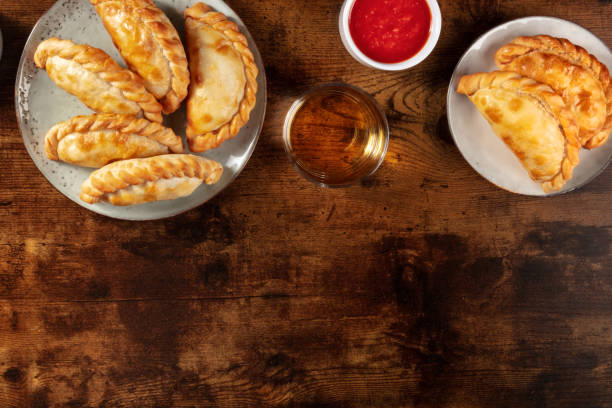 istock Empanadas with salsa and wine, shot from above with copy space 1299045112