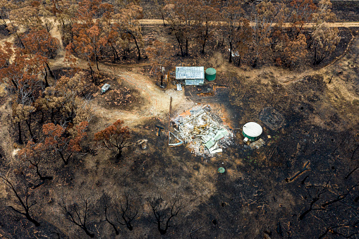 Aerial view of Australian bush fire destruction with a burnt home & property. Bell NSW 2020 bush fires - Blue Mountains