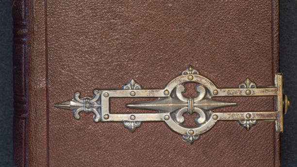 istock Old leather and metal book cover 1299046899
