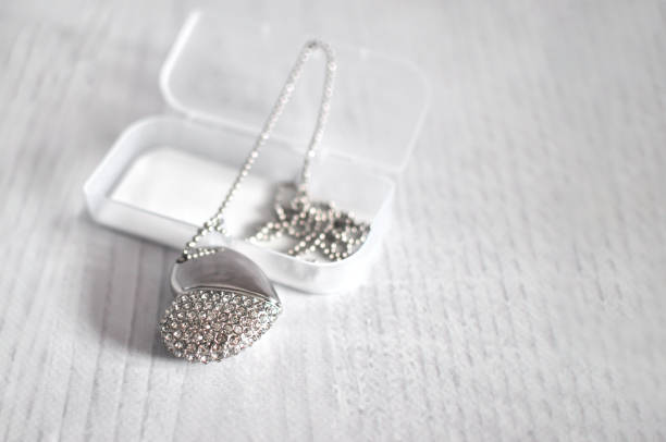 istock Heart with stones like Swarovski on a chain. Keychain, defocusing 1299047247