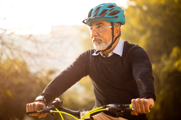 istock Mature man enjoying a bicycle ride 1299047298