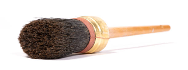 istock Old paintbrush isolated on a white background 1299048146