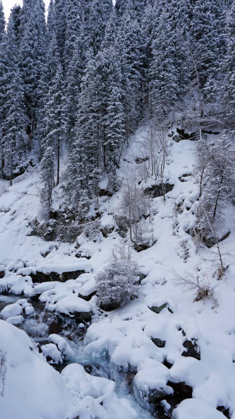 istock A clear mountain river runs through a snowy gorge 1299048248