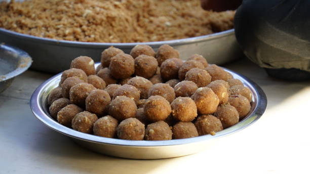 Indian Glue Laddu or Suji laddu closeup with Kaju and saffron mixed. Famous Indian sweets. Famous winter season sweets in India. Laddu made by Wheat floor and Acacia tree Glue. Healthy vegetarian seasonally food. rawa island stock pictures, royalty-free photos & images