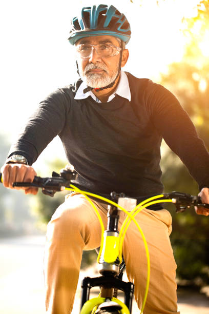 istock Mature man enjoying a bicycle ride 1299050281