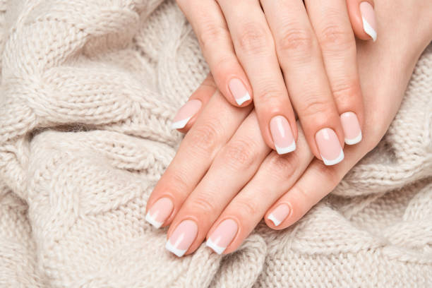 istock studio shot Beautiful Female Hands with French manicure 1299051398