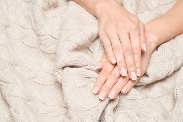istock studio shot Beautiful Female Hands with French manicure 1299051400