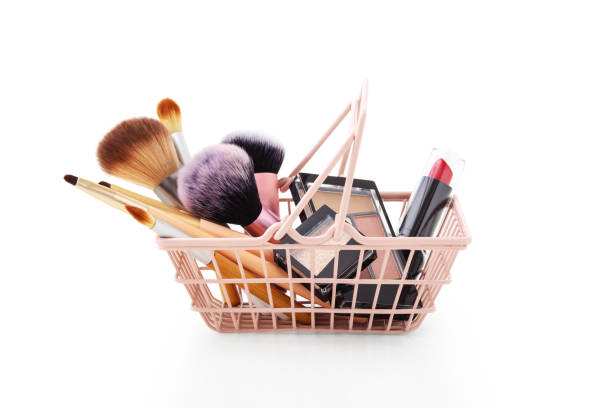 istock Makeup products in shopping basket isolated on white 1299052860