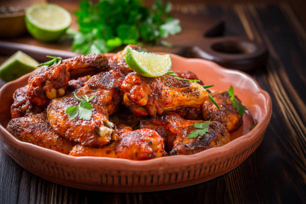 istock Hot and Spicy Buffalo Chicken Wings with ingredients 1299055244