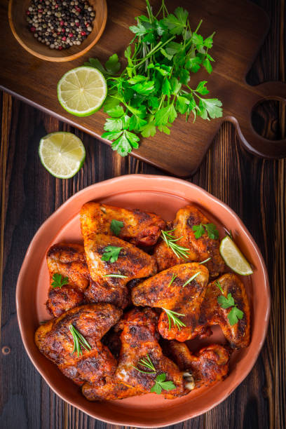 istock Hot and Spicy Buffalo Chicken Wings with ingredients 1299055398