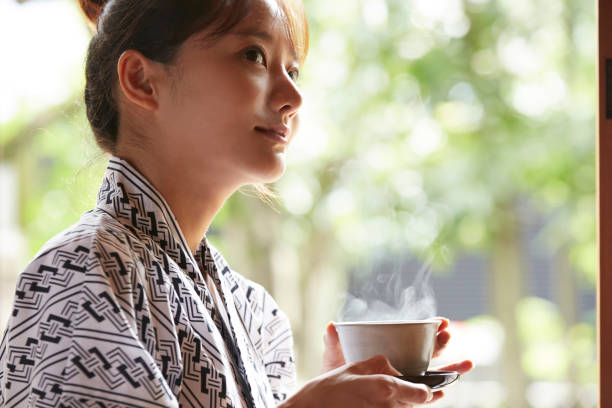 A young Asian woman is relaxing at Japanese traditional inn