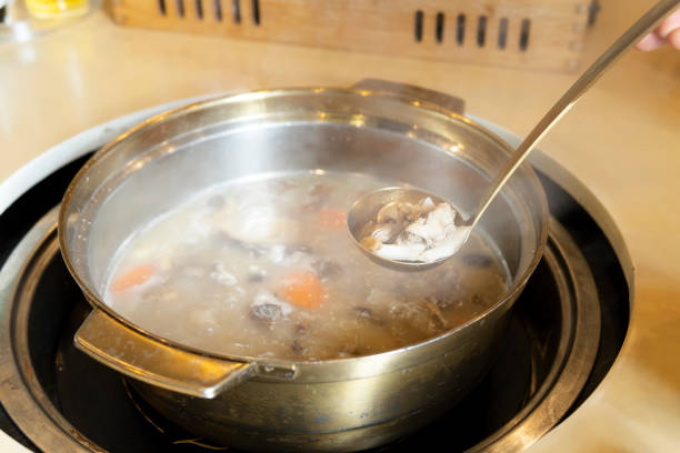 istock Spooning lamb from the boiling lamb hot pot 1299058215