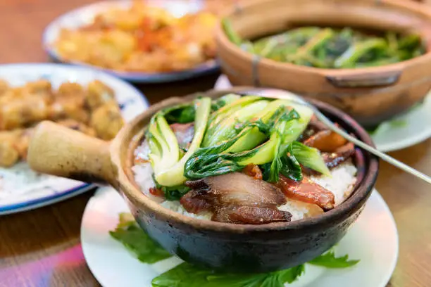 Delicious Cantonese traditional cuisines including Claypot Rice with Cured MeatIn, Braised Water Spinach with Shrimp Paste, Garlic Ribs and Fried Eggs in Guangdong.