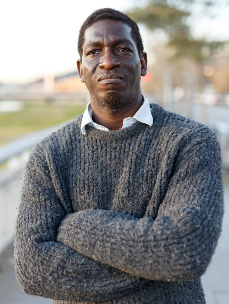 istock Portrait of positive African man 1299059319