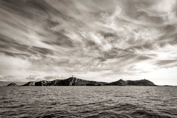 a black and white view of the Sanguinaires Islands under a cloudy sky