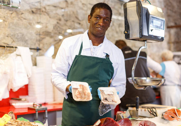 istock Salesman portrait in fish shop 1299059598