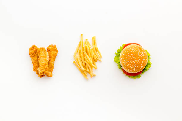 istock Fast food flat lay set. Burger with fried potatoes and chicken, top view 1299060183